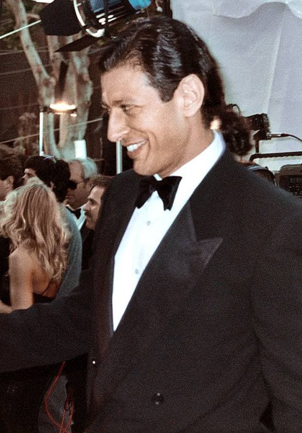 Jeff Goldblum smiling in a dinner jacket and bow tie