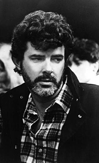 George Lucas, bearded, in a checked shirt, in black and white