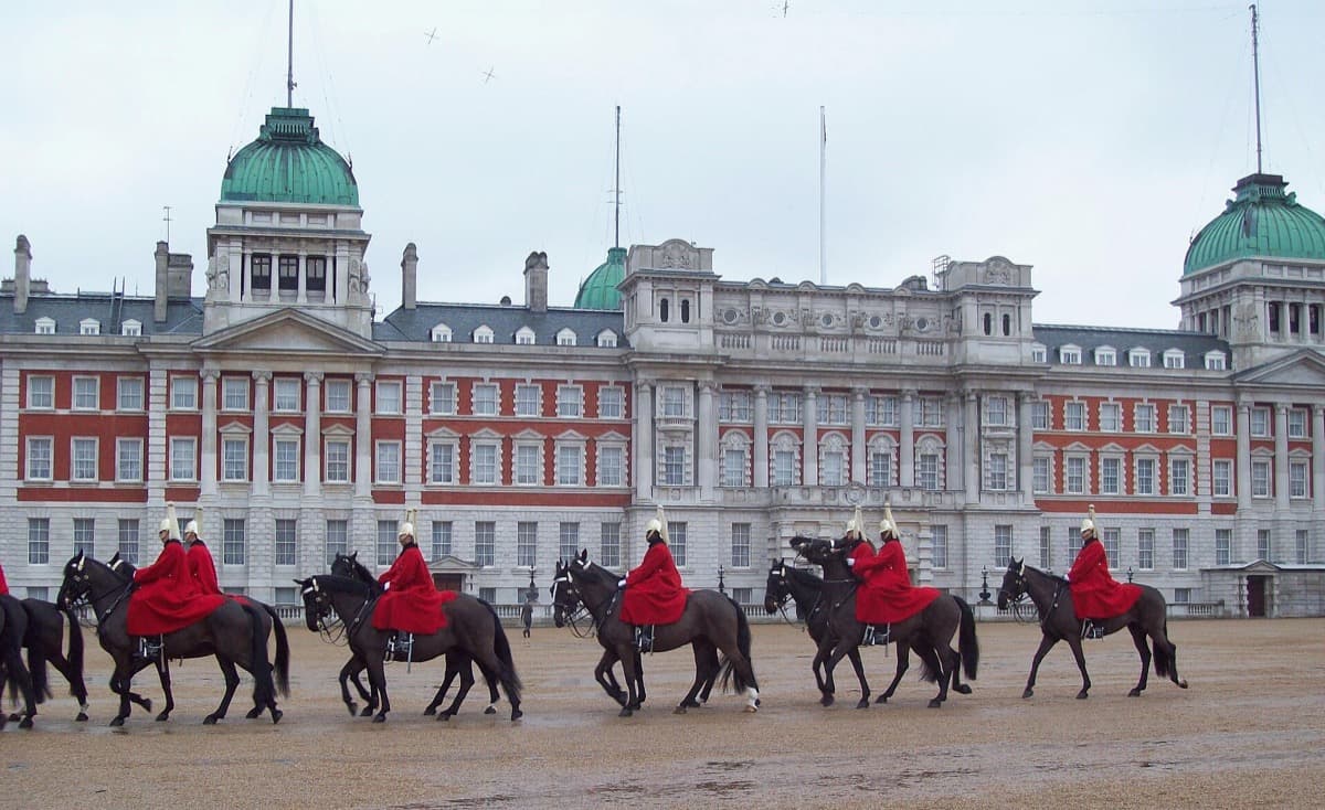 A wide gravel parade ground with Whitehall buildings behind