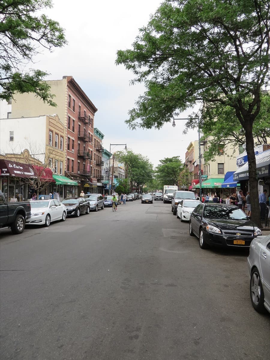 Shops and awnings along Arthur Avenue in Belmont, the Bronx.