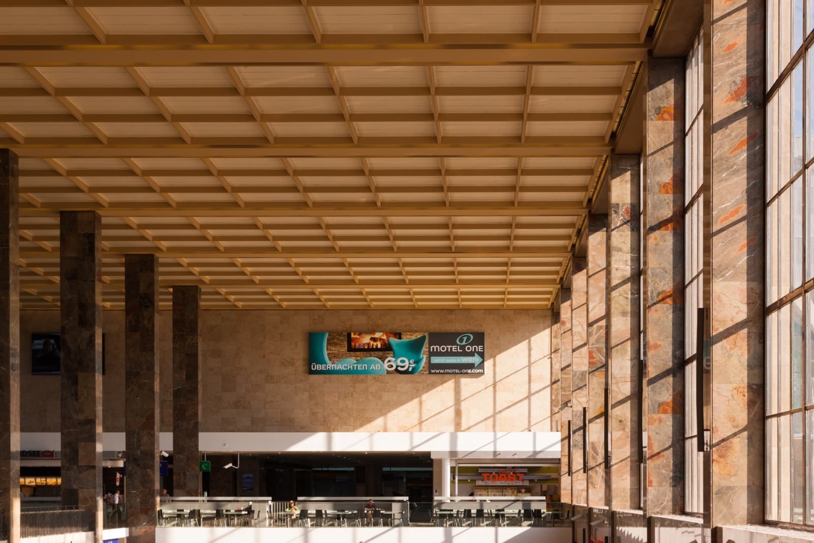 The long, glazed 1950s hall of Vienna’s Westbahnhof, with a coffered ceiling
