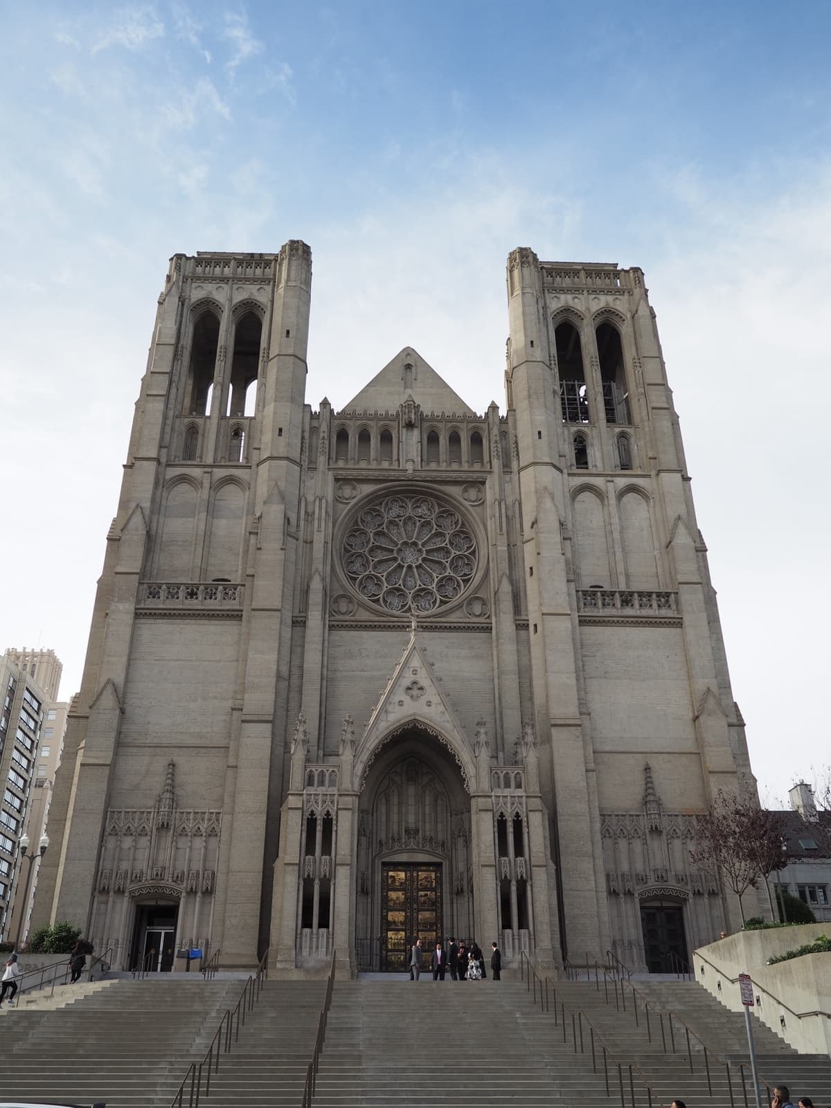 The twin-towered Gothic front of a cathedral in pale concrete