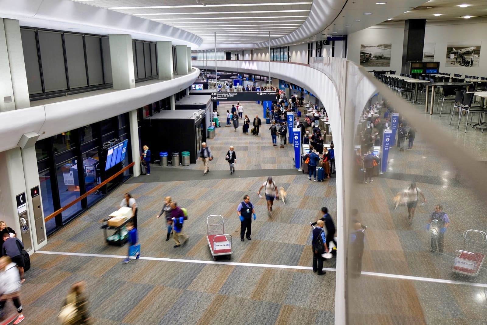 Inside an airport terminal with high windows