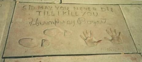 A concrete slab with Bogart’s hand and shoe prints and the inscription “Sid, may you never die till I kill you”