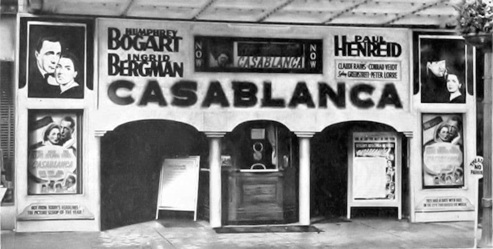 A 1942 cinema frontage spells CASABLANCA in large letters above the doors, with Bogart, Bergman and Henreid billed