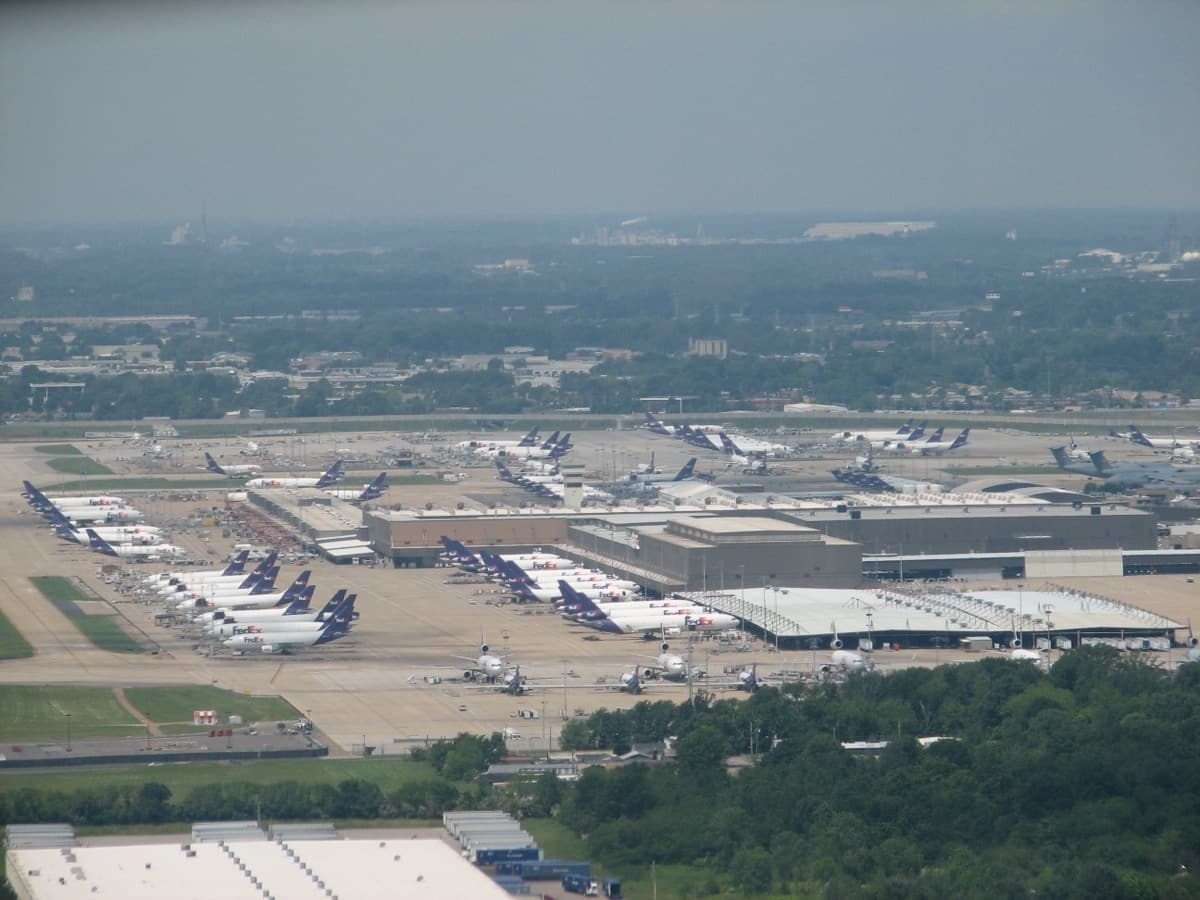 Purple-and-orange cargo jets parked at the FedEx hub in Memphis.