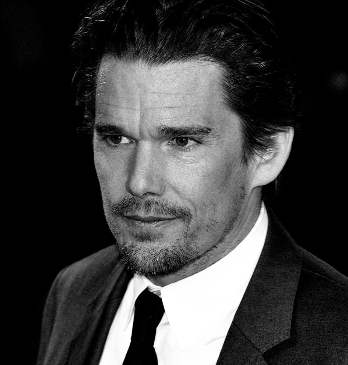 Ethan Hawke in a dark suit and tie, black and white, 2009