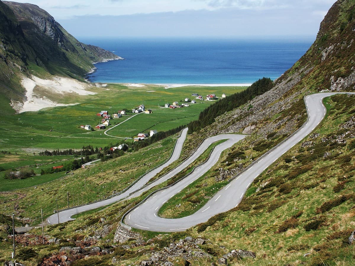 A rugged headland above a surf-washed bay on the Norwegian coast
