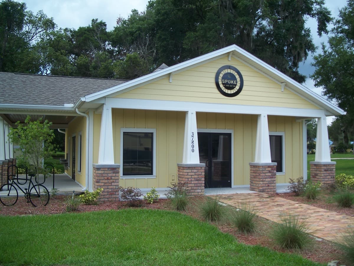 A small visitor information building beside a trail and a street in Dade City, Florida.