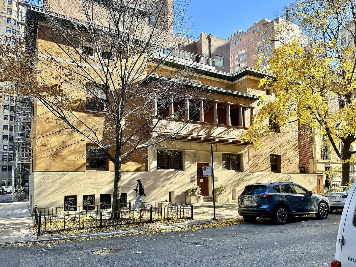 A pale brick and stone townhouse on a Gold Coast street corner