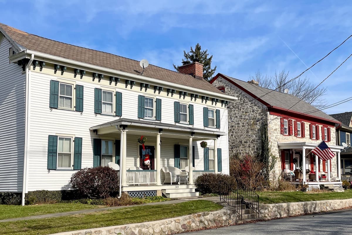A historic stone house on a village street