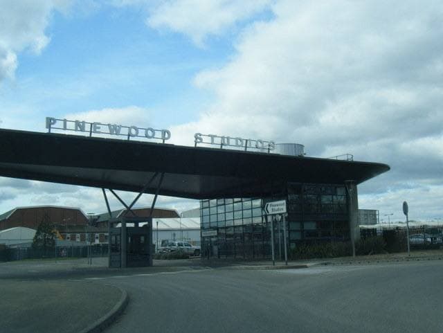 A modern gate canopy with PINEWOOD STUDIOS lettering on top