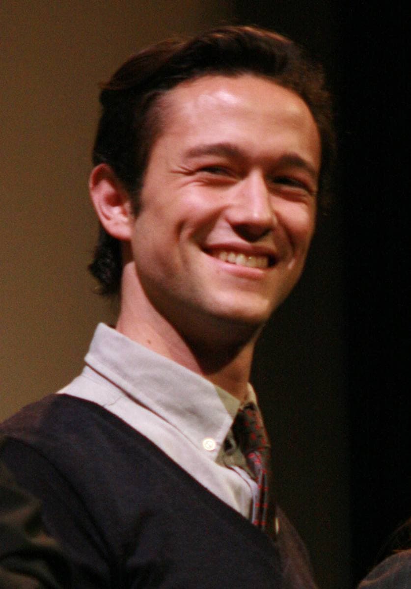 Joseph Gordon-Levitt smiling in a jumper, shirt and tie