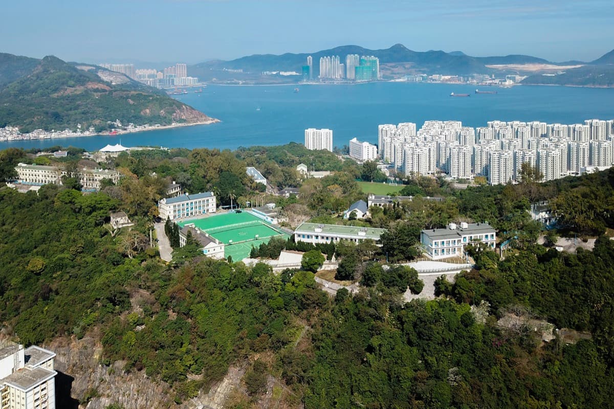 Buildings and trees of a holiday village on a hillside