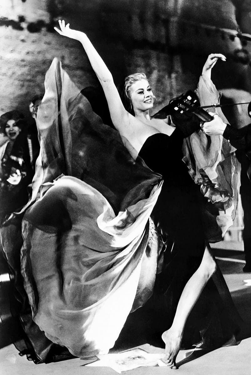Black-and-white photograph of Anita Ekberg in a strapless black gown