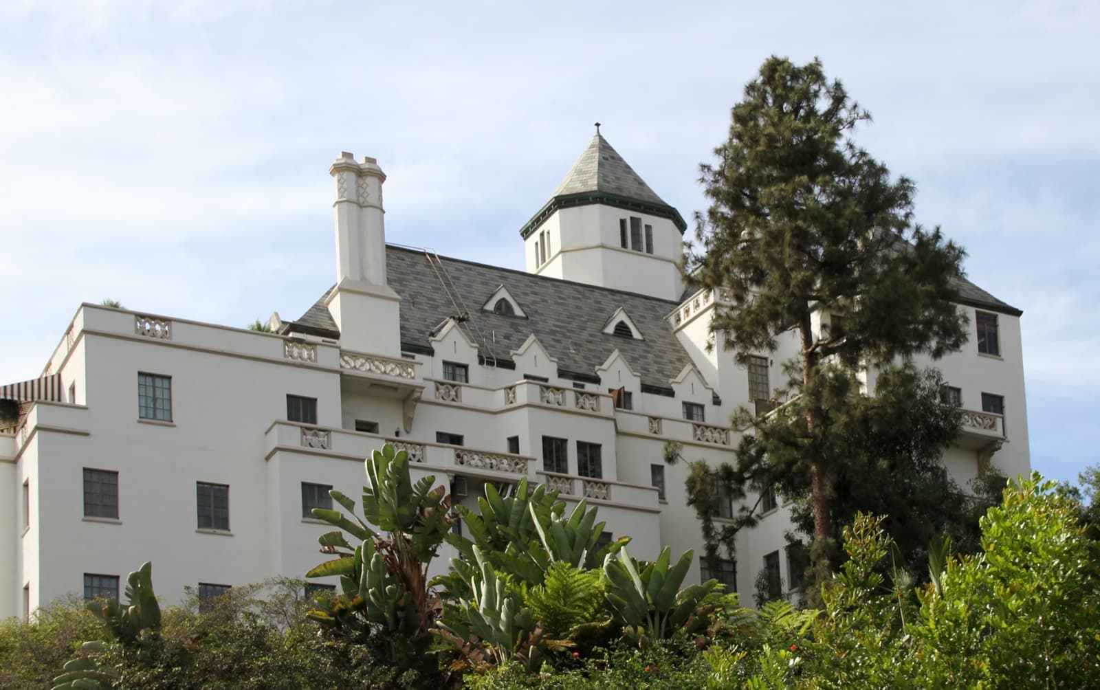 The white towers of Chateau Marmont rising above trees