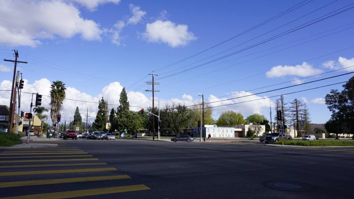 A wide crossing on Sepulveda Boulevard under a blue sky