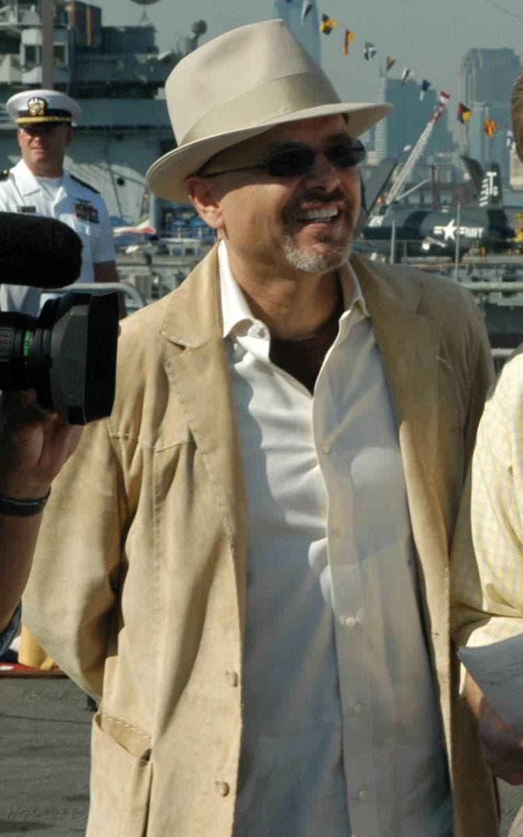 Joe Pantoliano in a pale hat and linen jacket