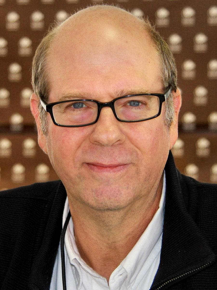 Stephen Tobolowsky in glasses, smiling