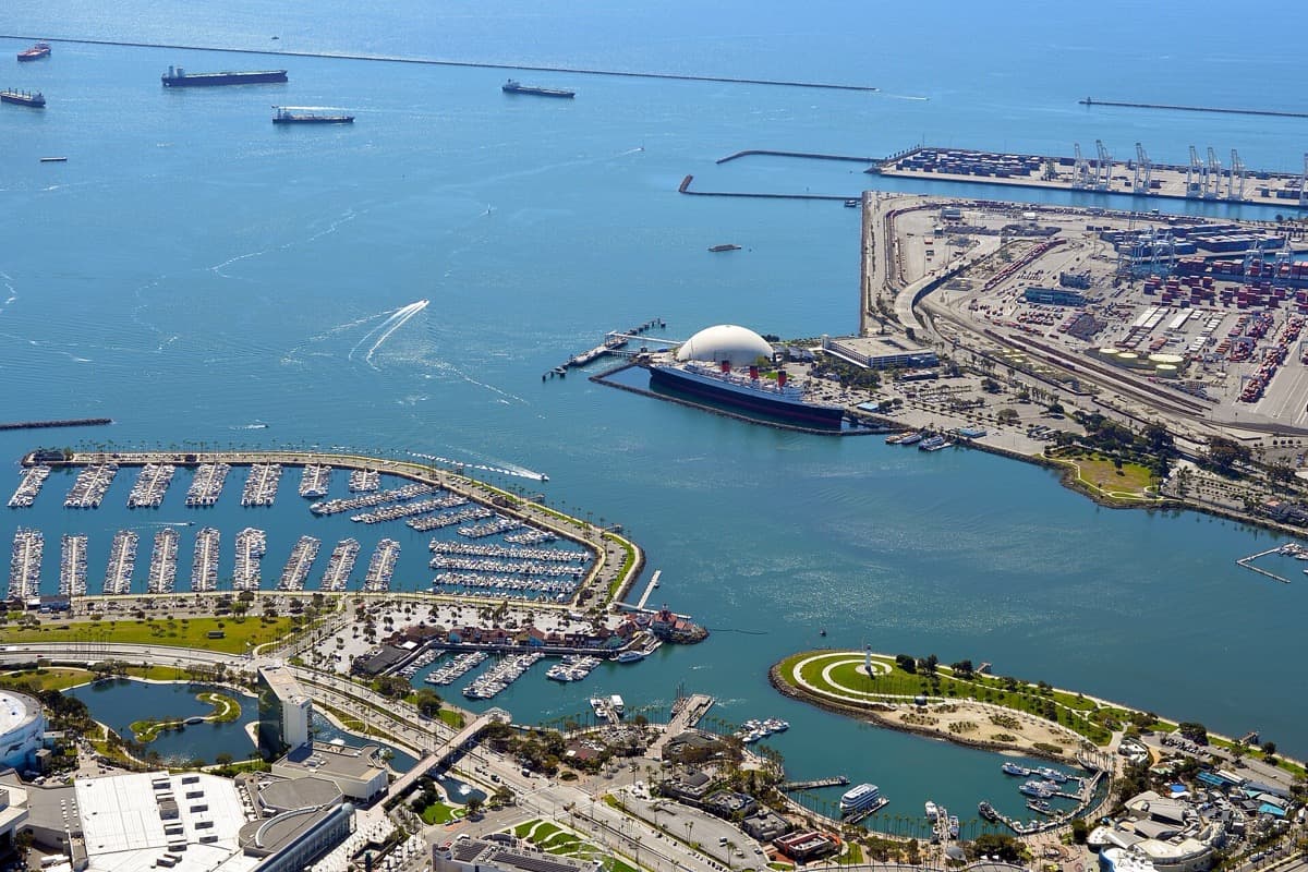 Container cranes and ships along a harbour front