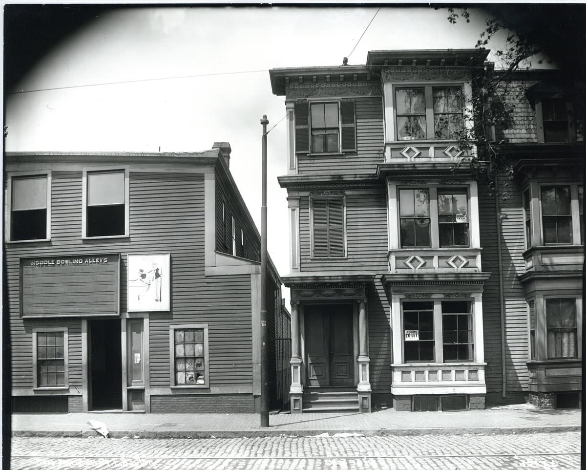 Two brick commercial buildings on a city street corner