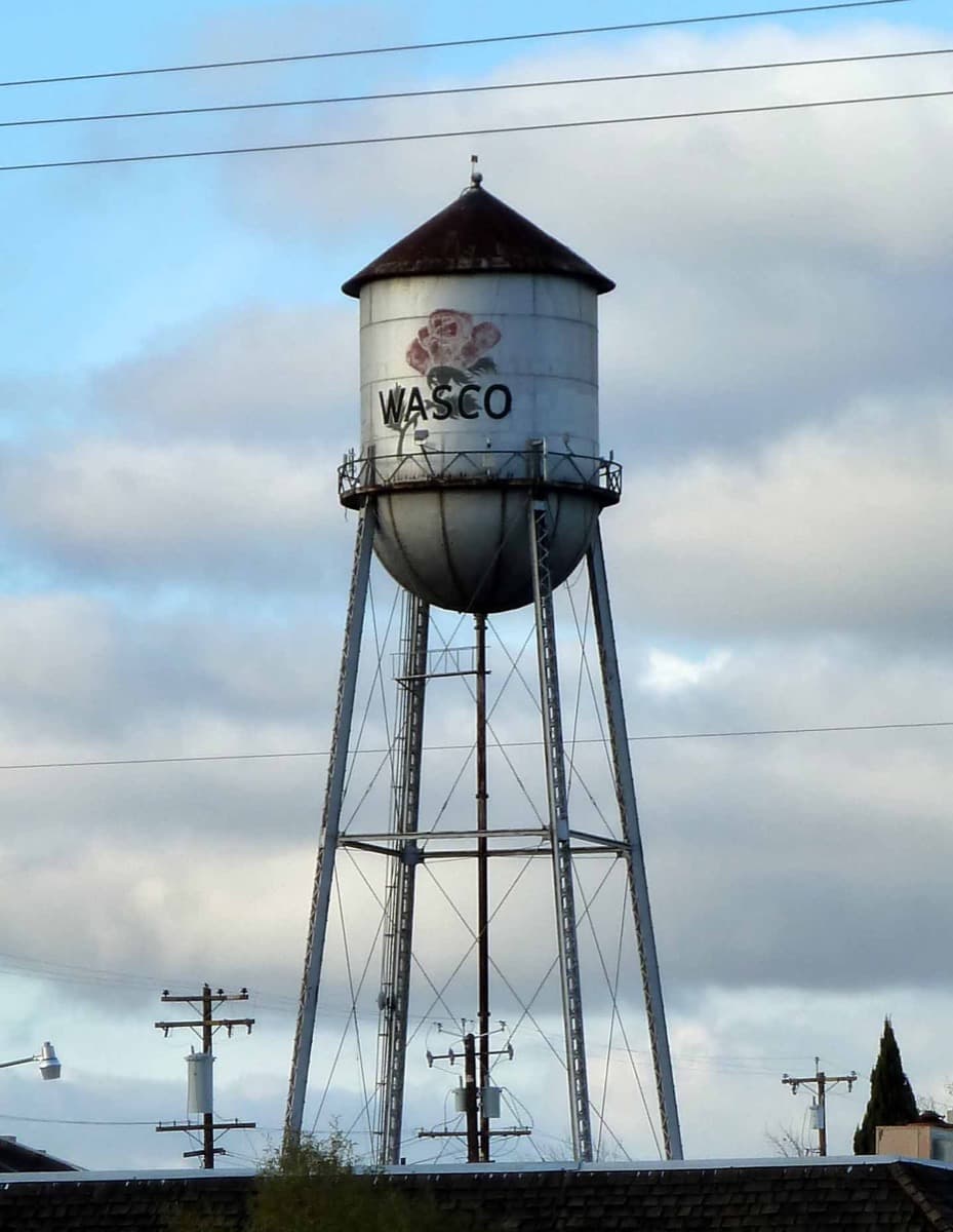 A water tower rising over a small Californian town