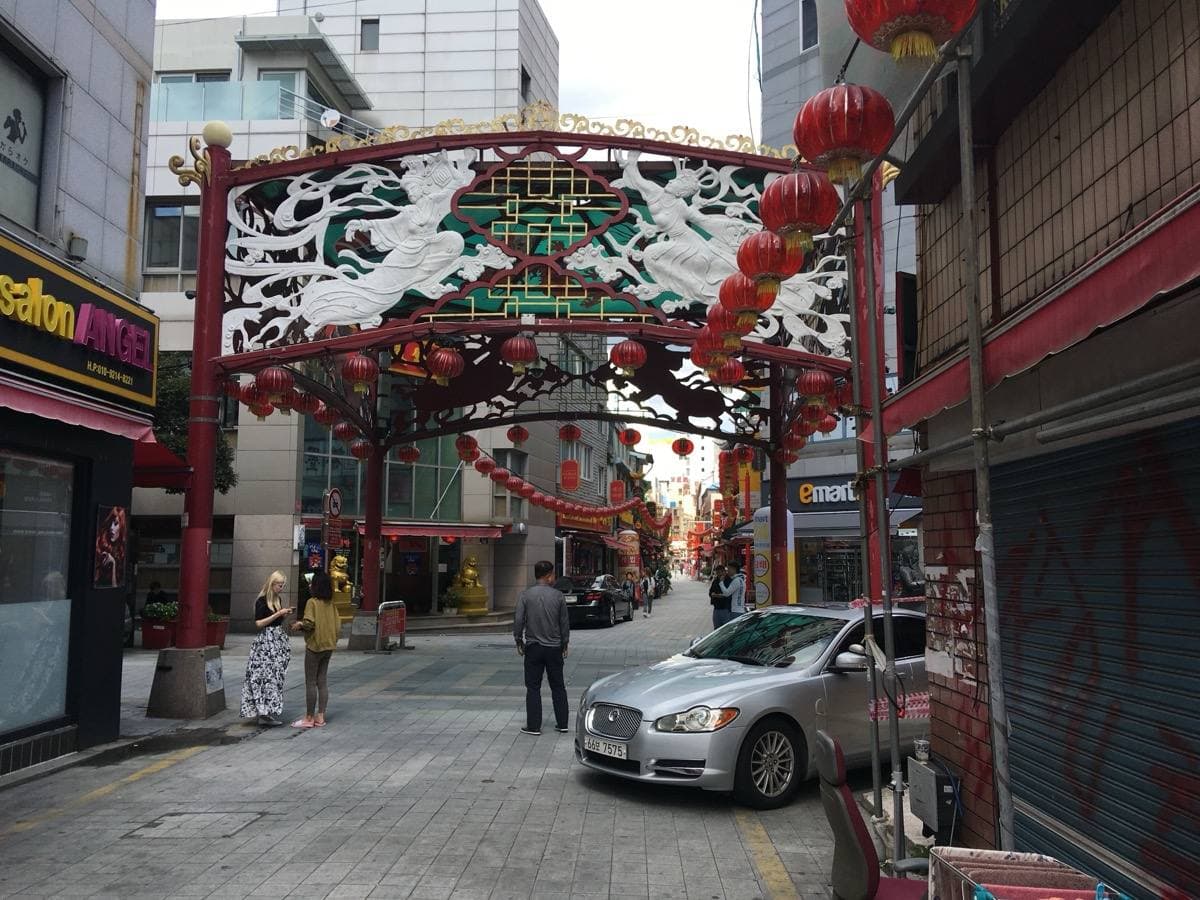 Shopfronts with Chinese signs on a street in Busan Chinatown