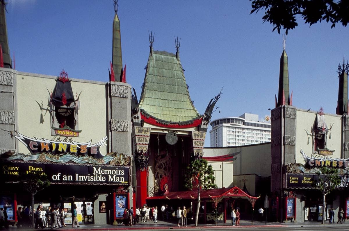The pagoda-roofed Chinese Theatre with its red columns and a film title on the marquee