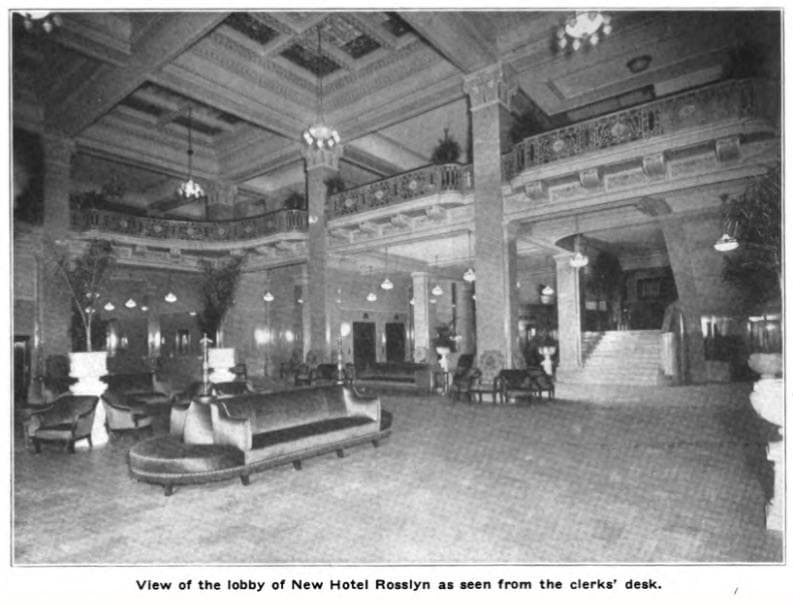 A grand hotel lobby with columns, a gallery and a tiled floor, 1917