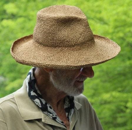 Frank Serpico, white-bearded, in a cap