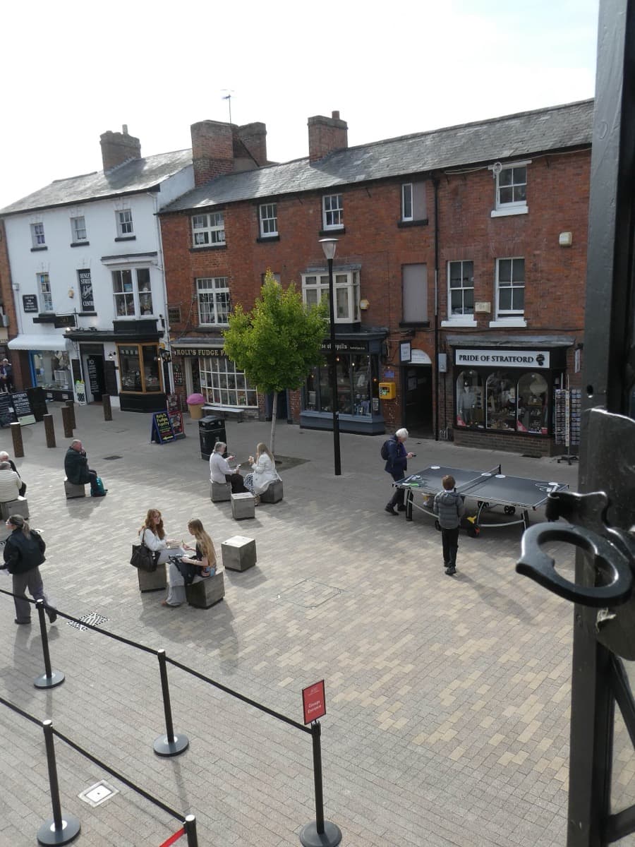 A street of old timber-framed and brick buildings