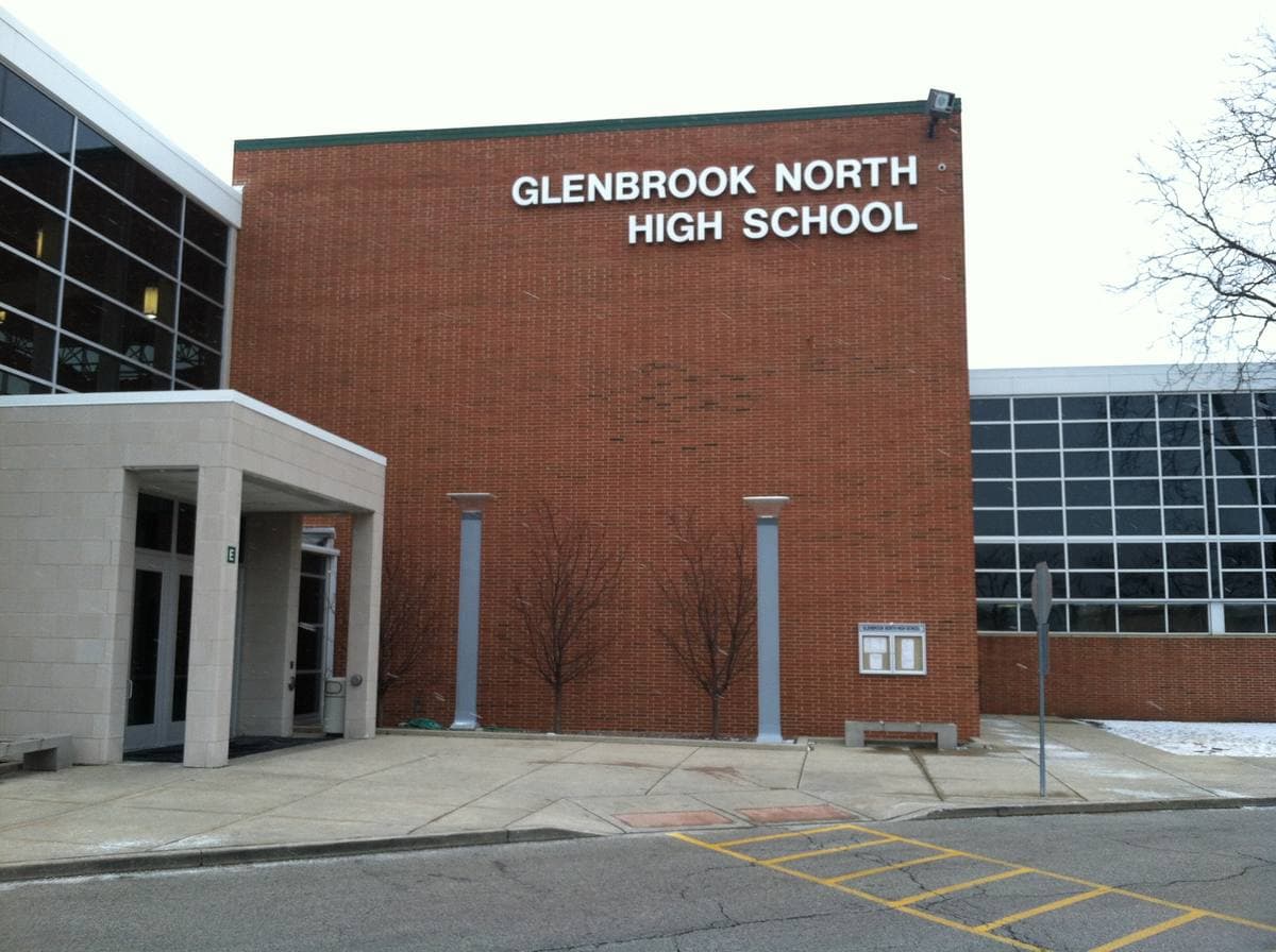 Red-brick Glenbrook North High School entrance with its name in silver letters