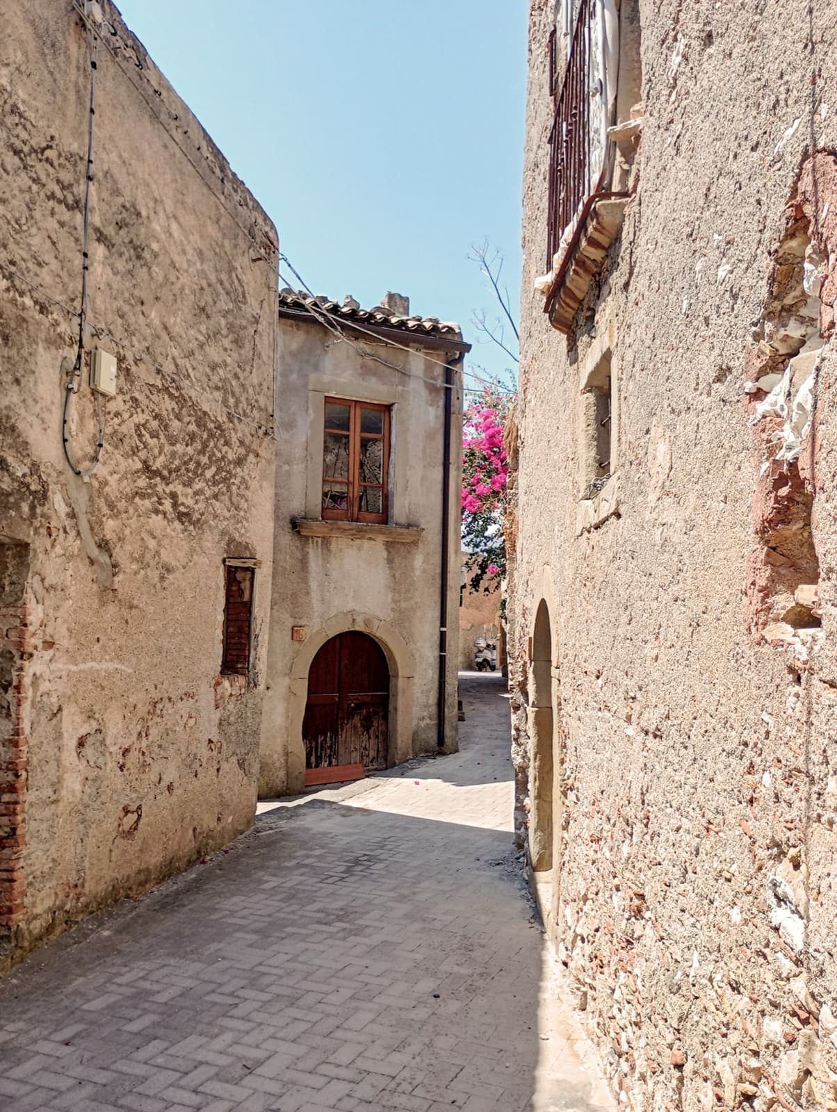 Stone houses and steps in the hill village of Forza d’Agrò