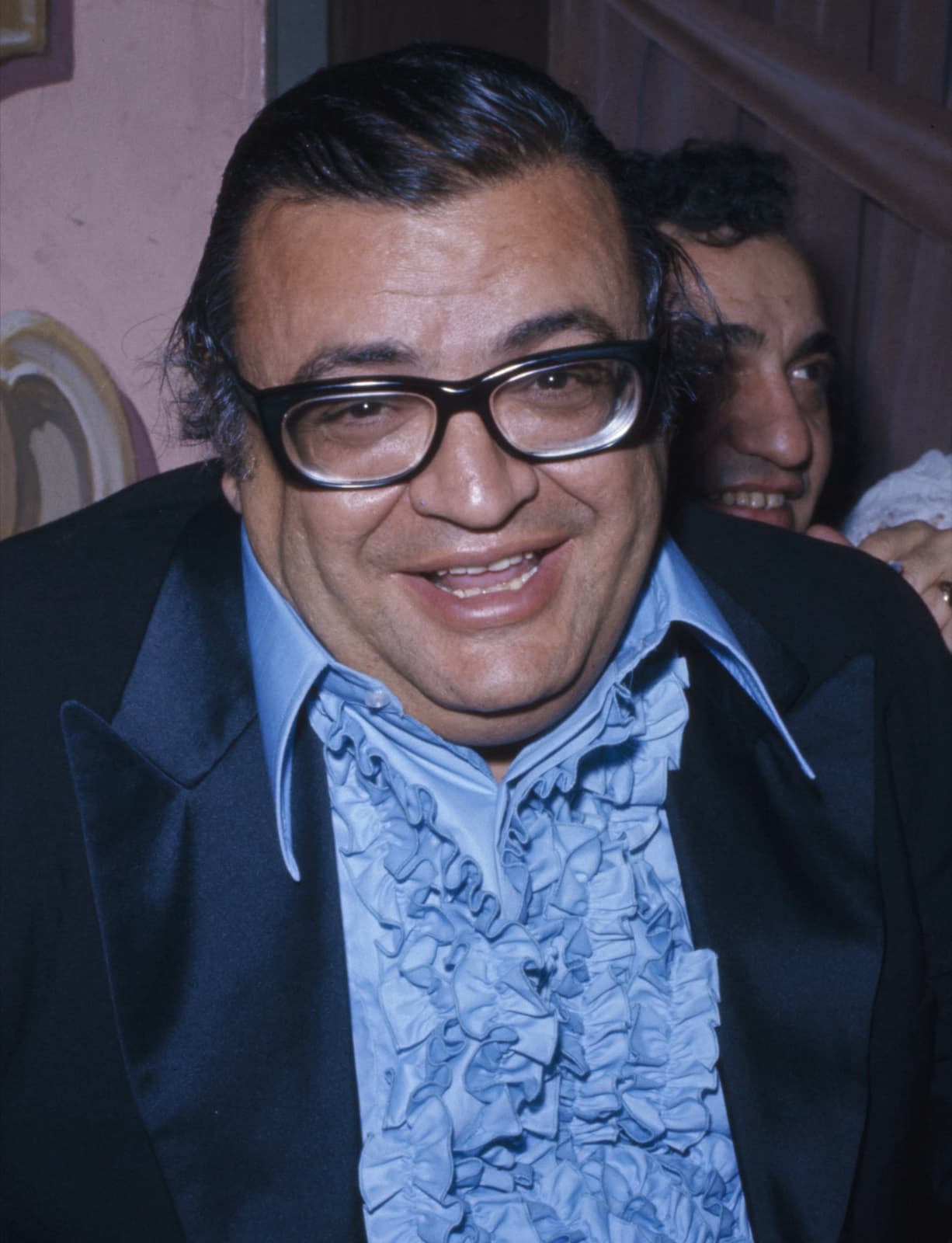 Mario Puzo smiling, in black and white