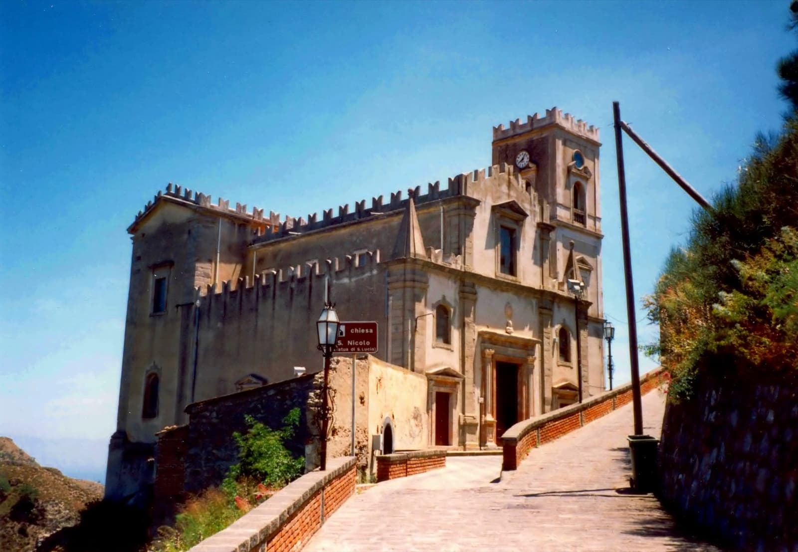 The church on its ridge above the village and the hills