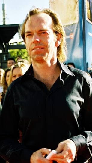 Hugo Weaving in a black shirt at an outdoor premiere