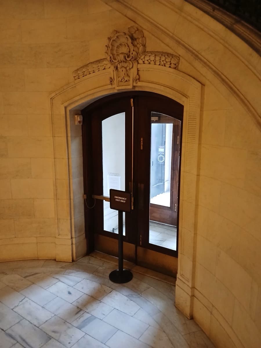 Stone columns and doors at the base of a grand customs house