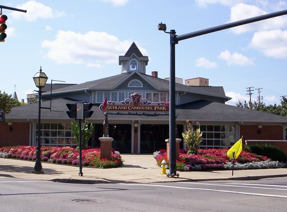 The glass pavilion of Richland Carrousel Park on a downtown Mansfield corner.