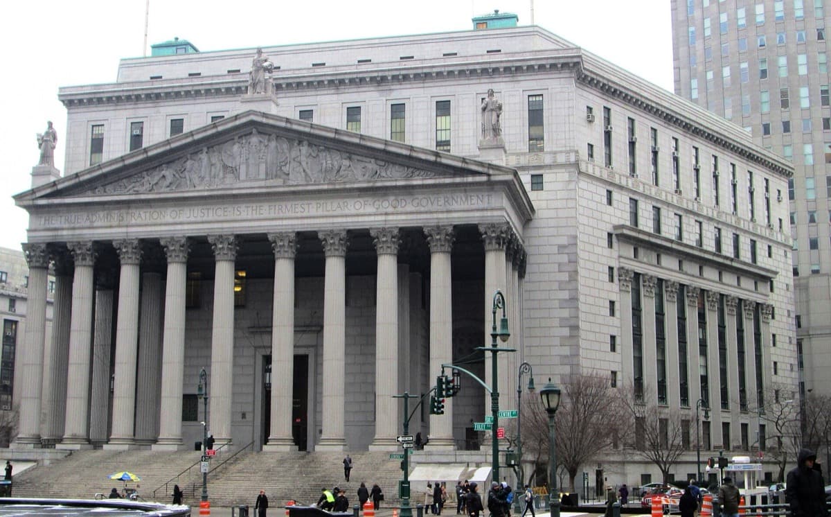 A broad columned courthouse with a wide flight of steps