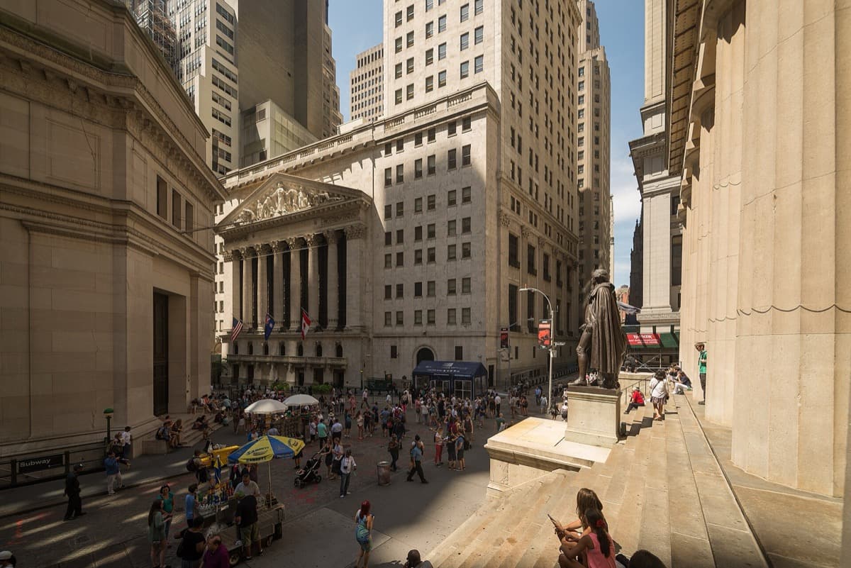 The columned front of the New York Stock Exchange beside Federal Hall