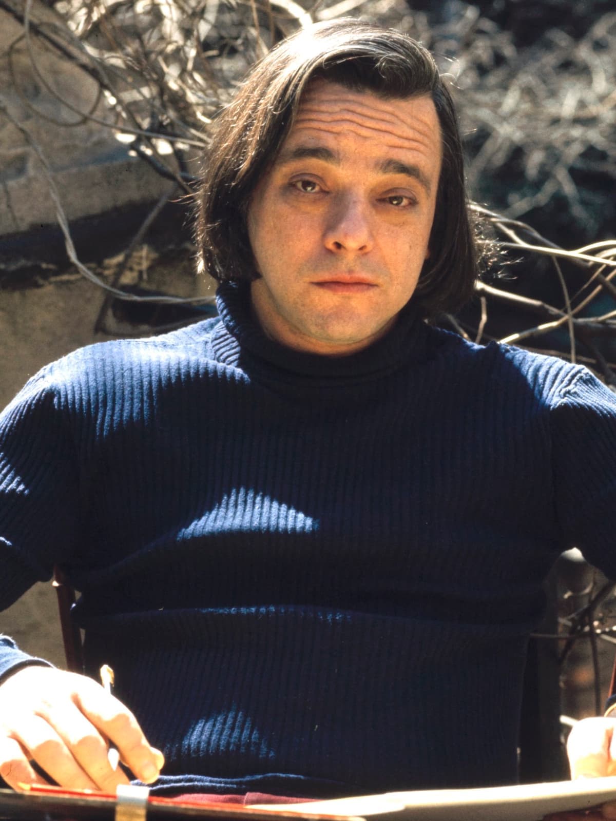 Stephen Sondheim in a dark jumper, seated