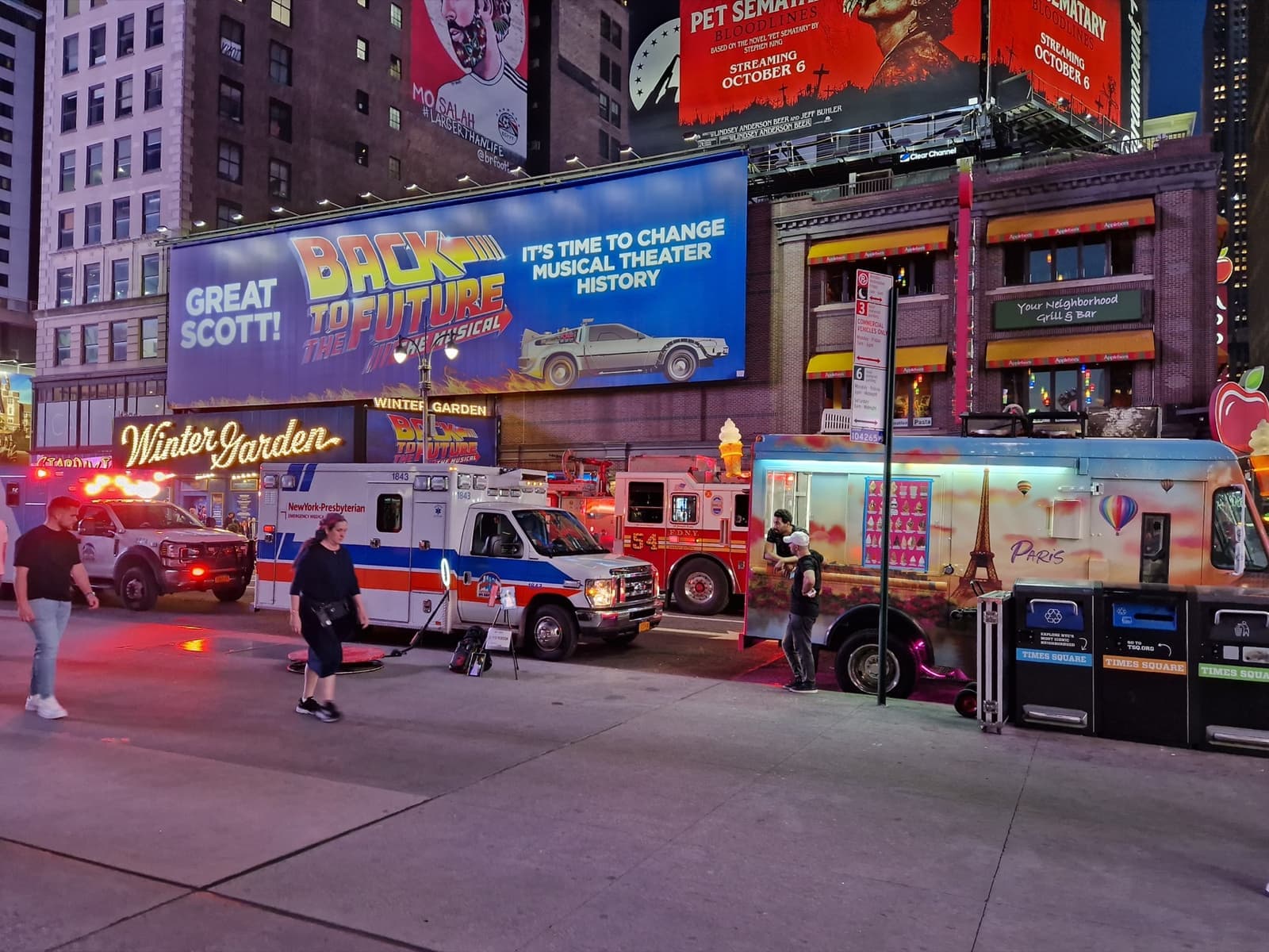 Broadway at dusk with the Winter Garden marquee and billboards