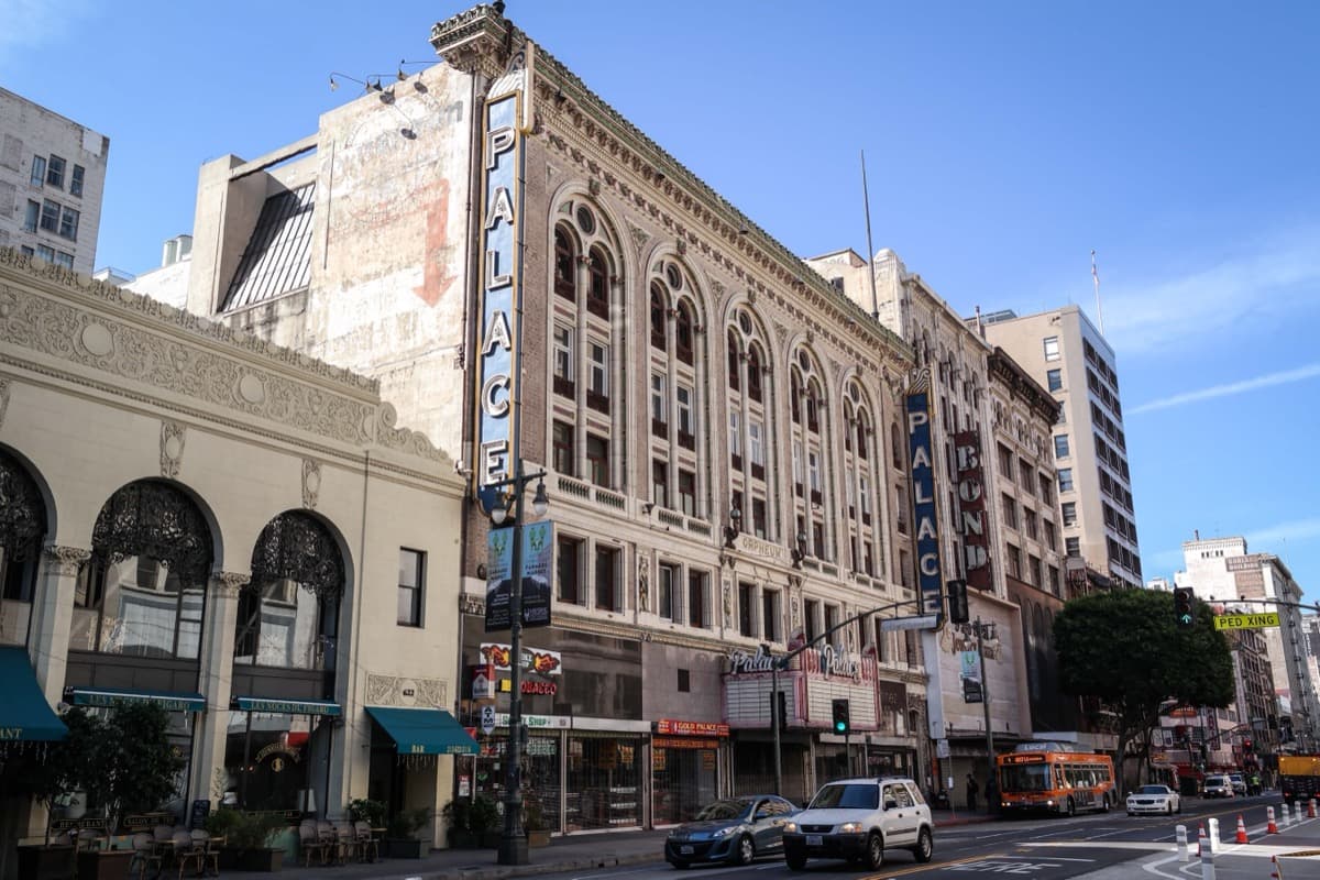 The terracotta front of the Palace Theatre on a downtown Los Angeles street