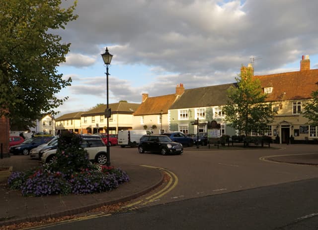 A broad market square lined with brick and stone buildings