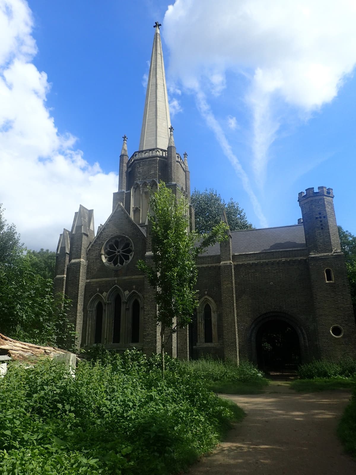 A Gothic chapel spire among trees in Abney Park
