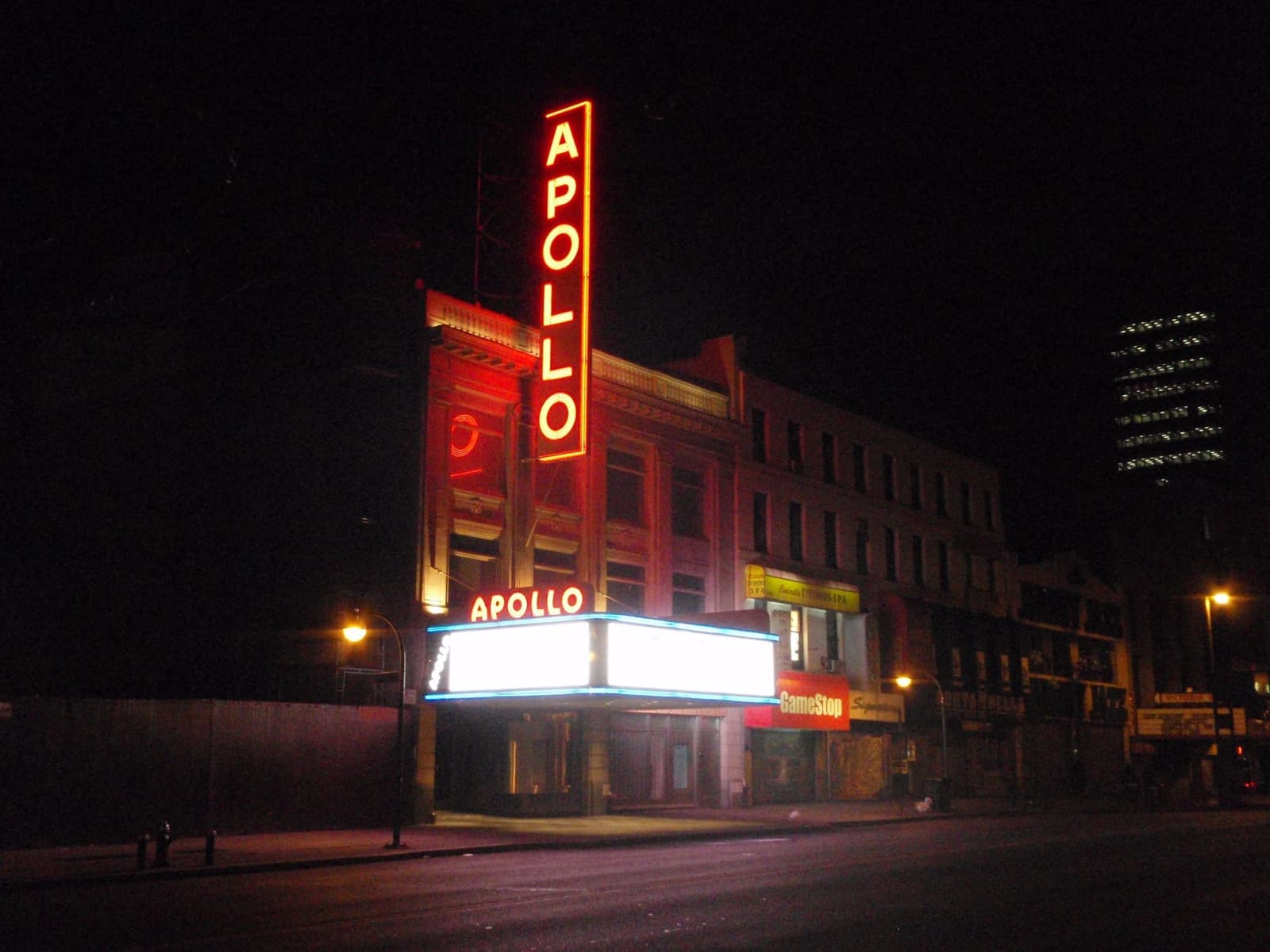 The Apollo Theater's red marquee and vertical sign on 125th Street