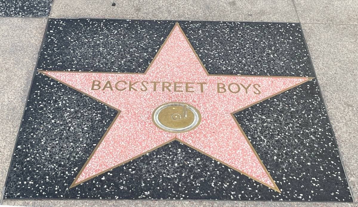 A pink terrazzo star with a gramophone emblem reading Backstreet Boys on the Hollywood Walk of Fame