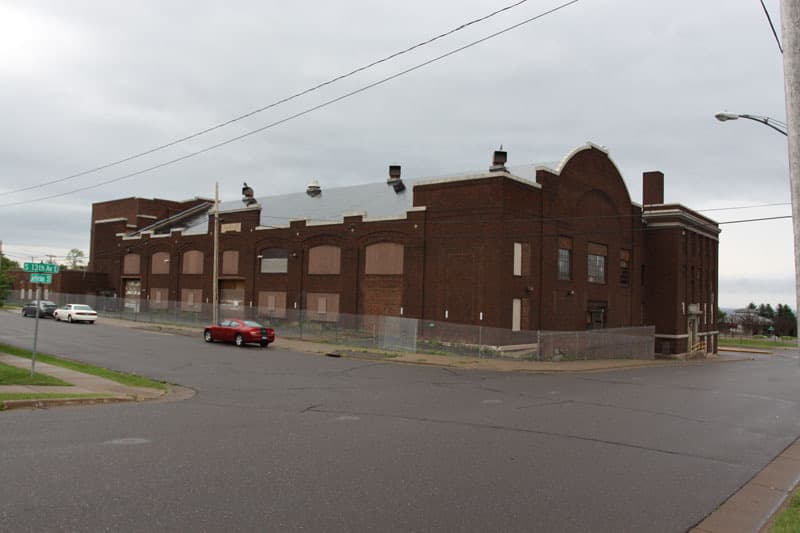 A brick armory building with a long drill hall