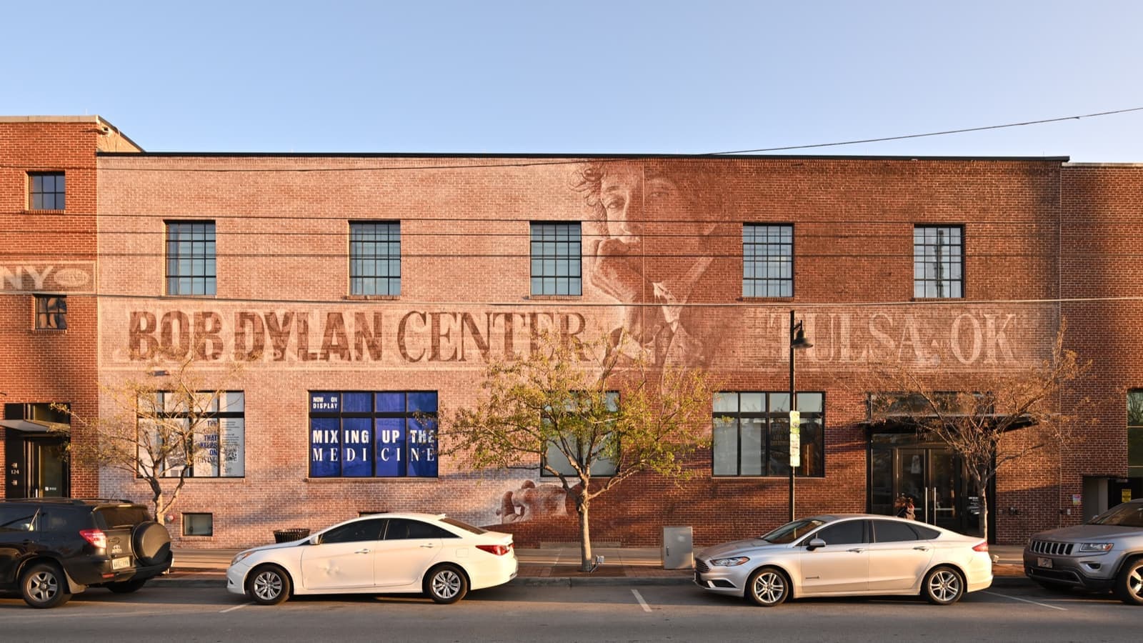 The Bob Dylan Center, a dark building with a large mural of Dylan