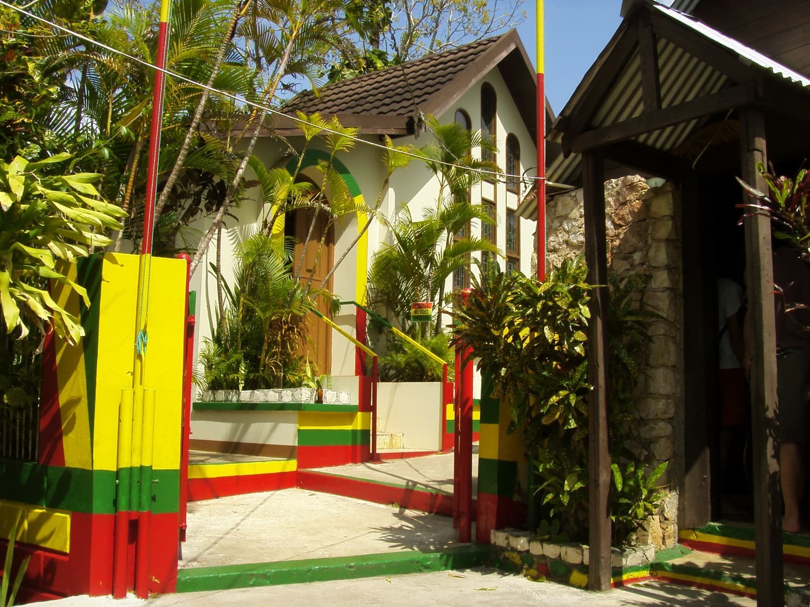 A painted gable with Bob Marley’s face and the words One Love at Nine Mile